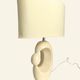 Cream ceramic table lamp with a mid-century design, featuring a lampshade.