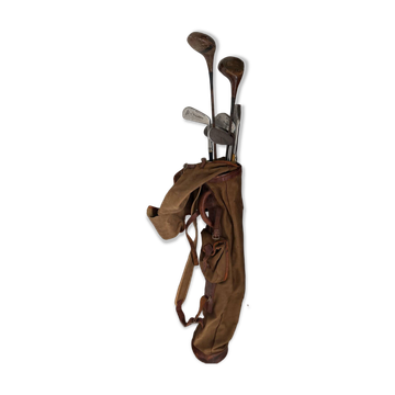 Old golf bag with 7 vintage clubs