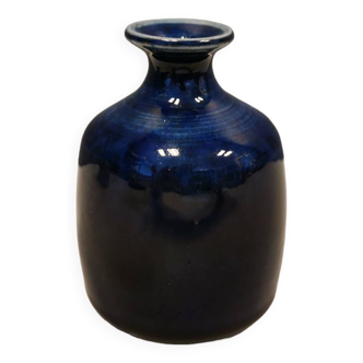 A small vase with blue running glaze with a ‘thin’ neck, from Swedish Kjell Sunesson