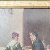Couple seated at a table in an inn, signed oil on panel, 19th century