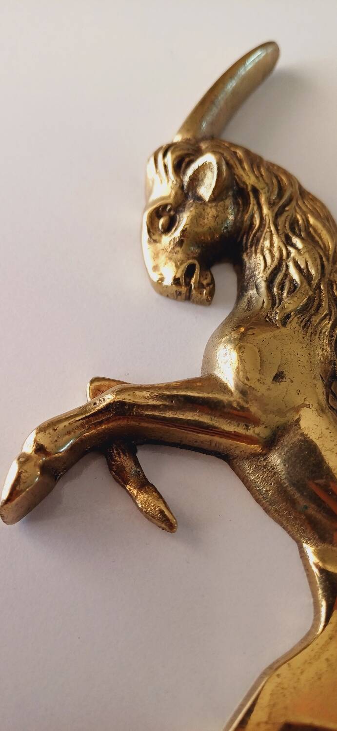 Animal bottle opener in gilded bronze