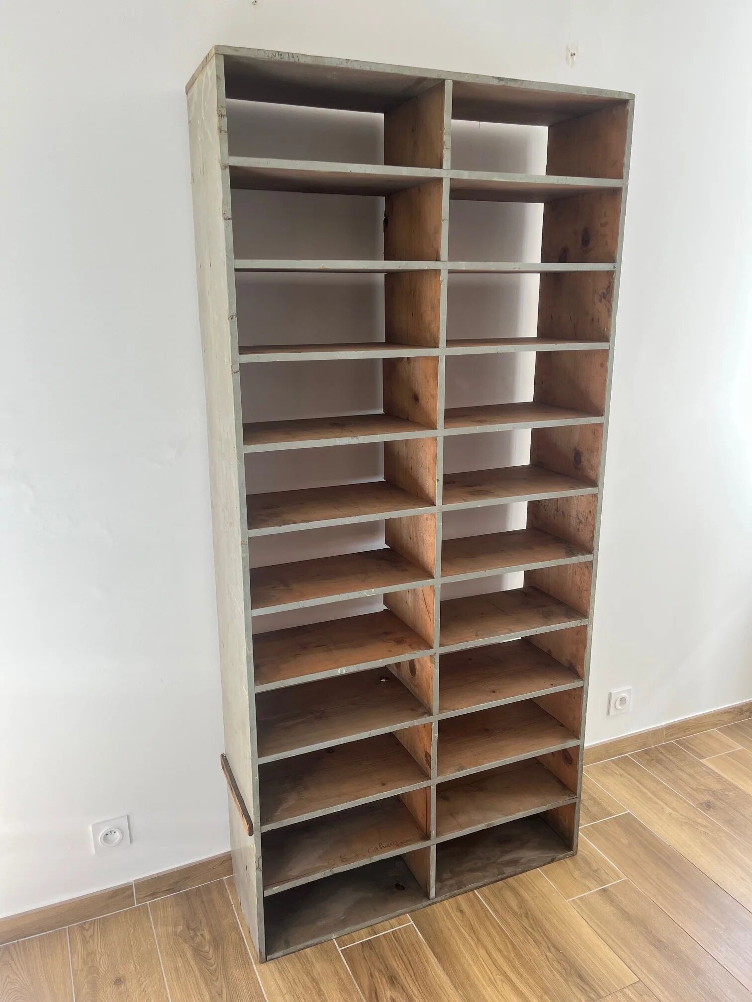 Large antique workshop cabinet with patinated wooden compartments, 20th century.