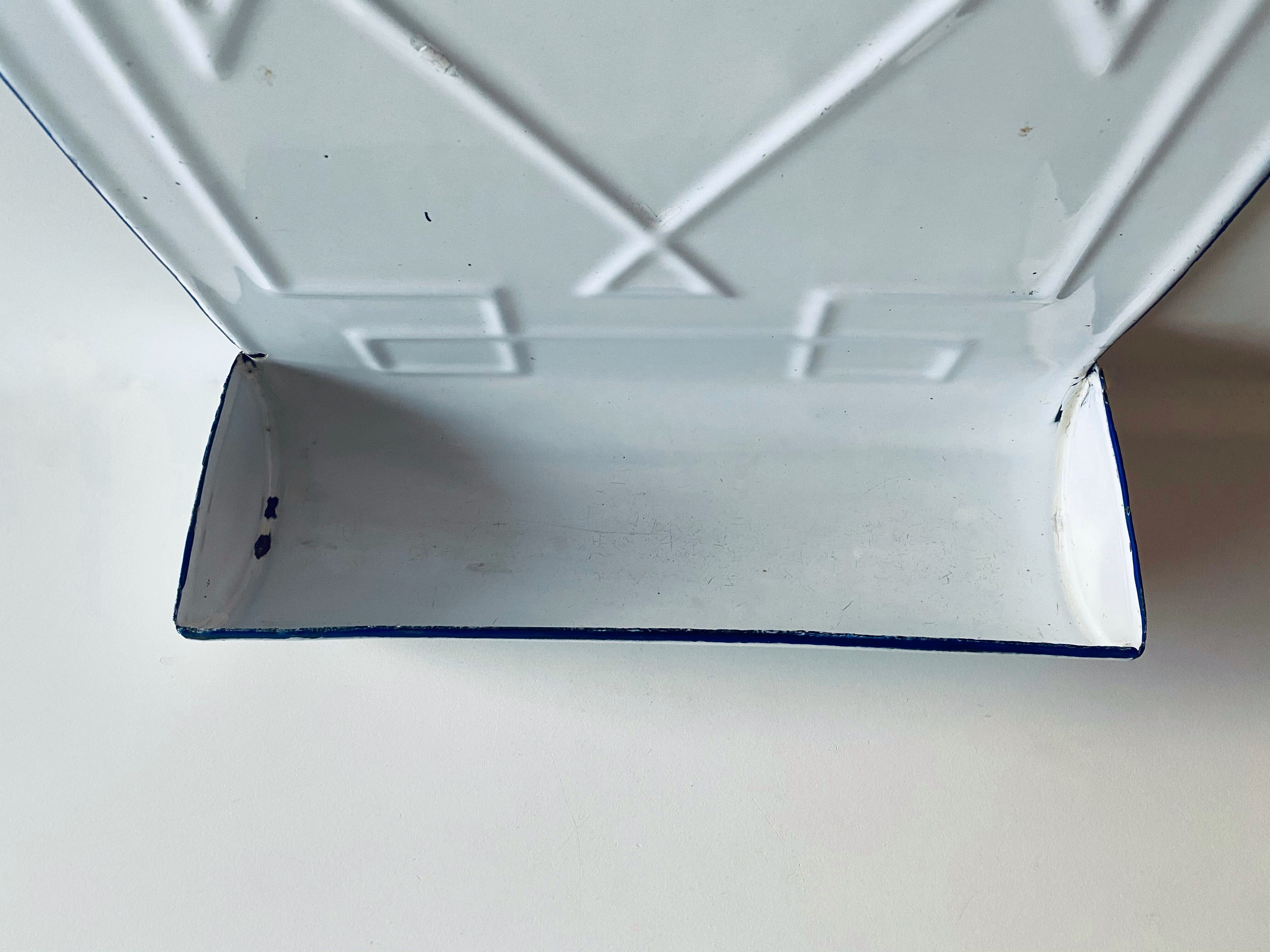 Old enamelled kitchen utensil display