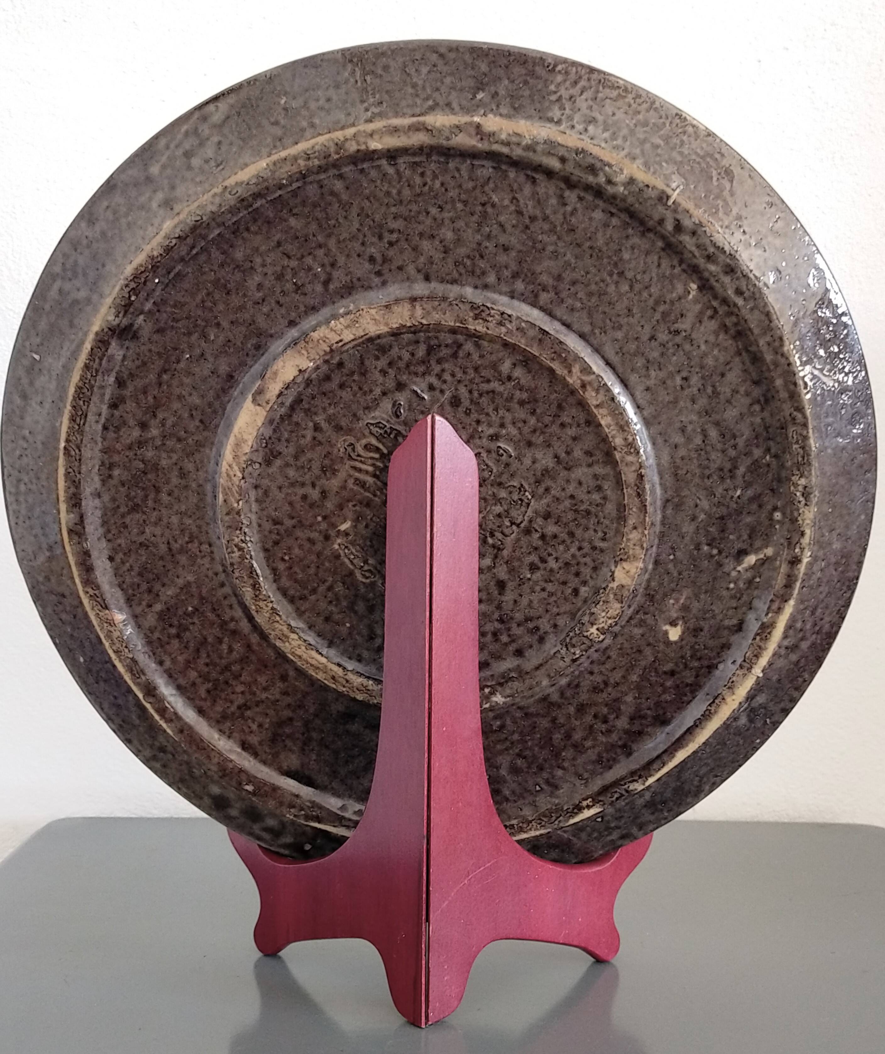 Dauphinois plate in glazed terracotta from around 1950 with dolphin decoration.