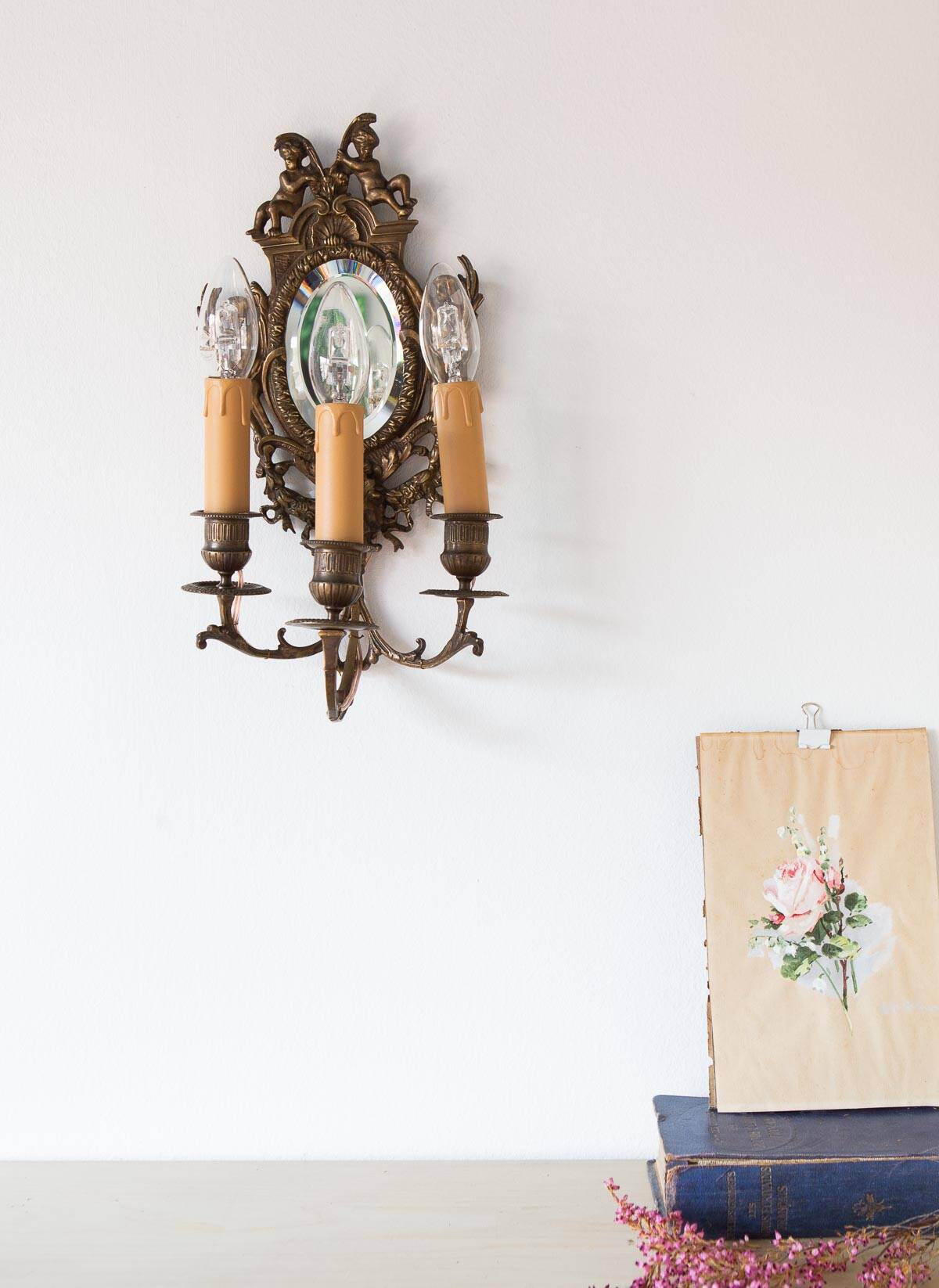 Pair of old French wall lights with beveled mirror and putti