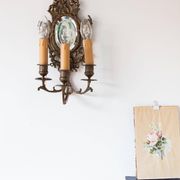 Pair of old French wall lights with beveled mirror and putti