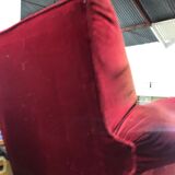 Red armchair with decorated base