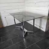 Chromed metal table with smoked glass top