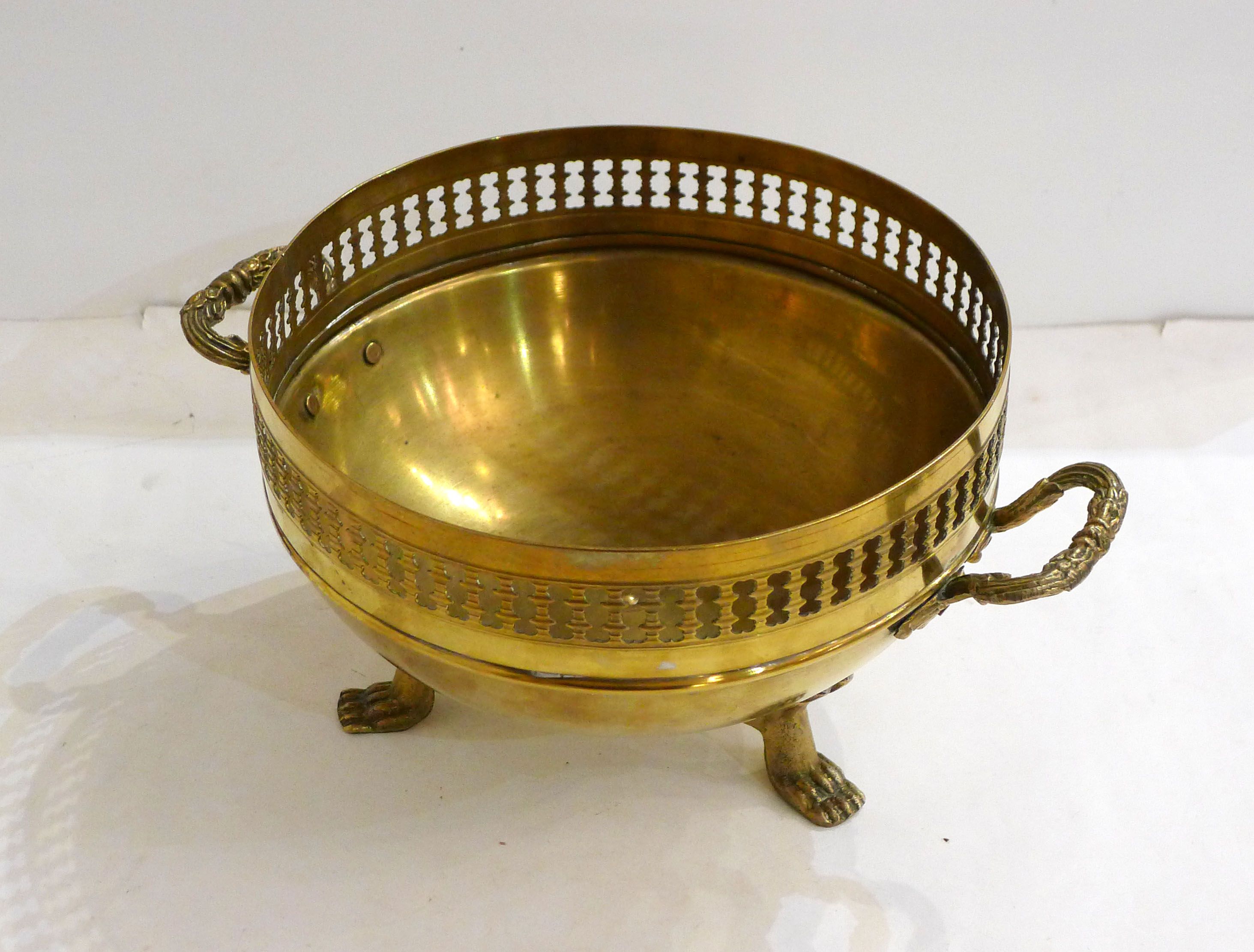 Planter on lion legs, made of golden metal