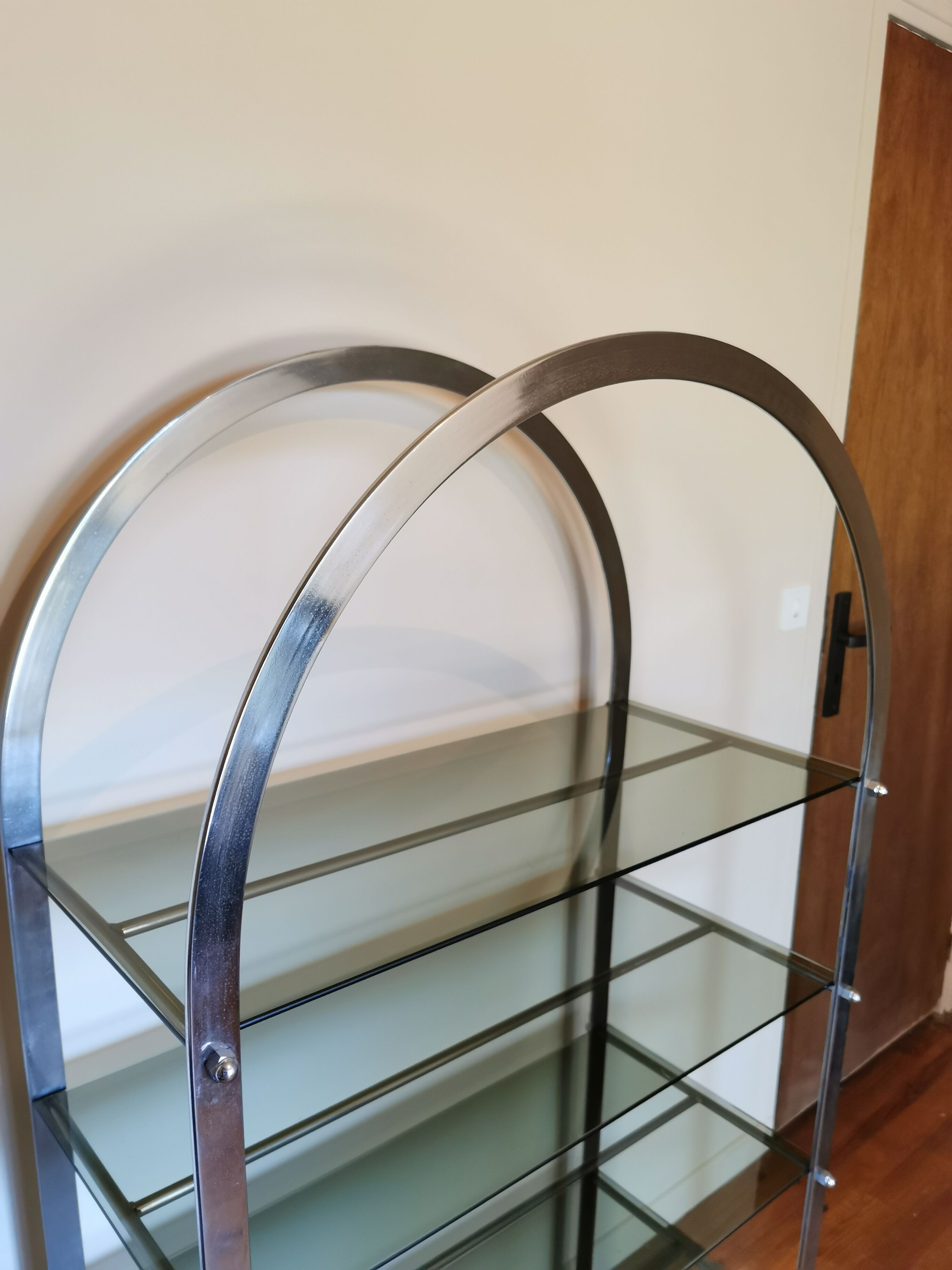Rounded shelf from the 70s in chrome metal and glass