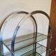 Rounded shelf from the 70s in chrome metal and glass