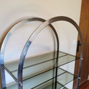 Rounded shelf from the 70s in chrome metal and glass