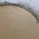 Brutalist round hammered gold metal mirror