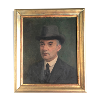 Oil on panel: portrait of man in hat