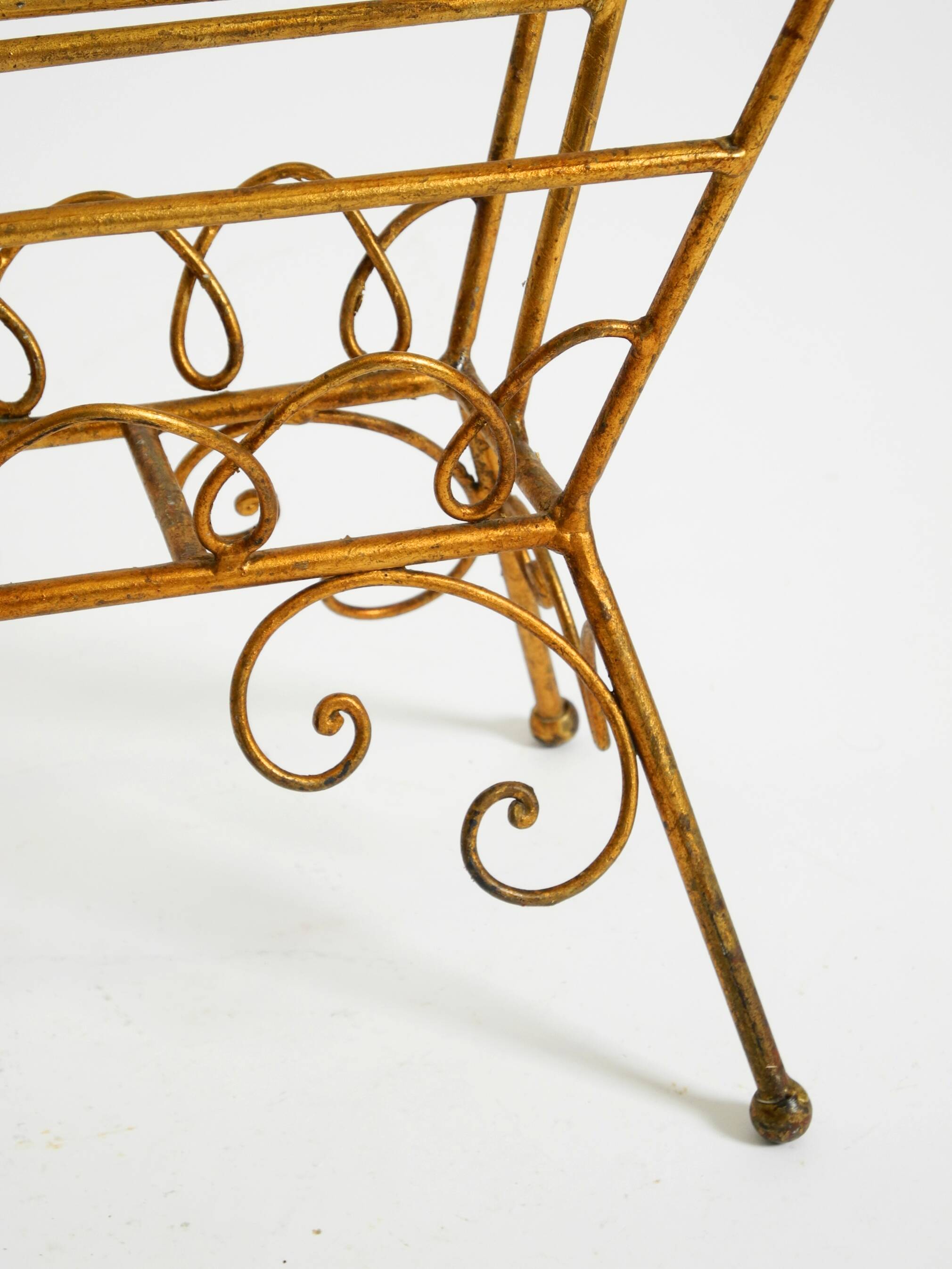 Extraordinary mid-century newspaper and magazine rack with a gilded metal