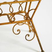 Extraordinary mid-century newspaper and magazine rack with a gilded metal
