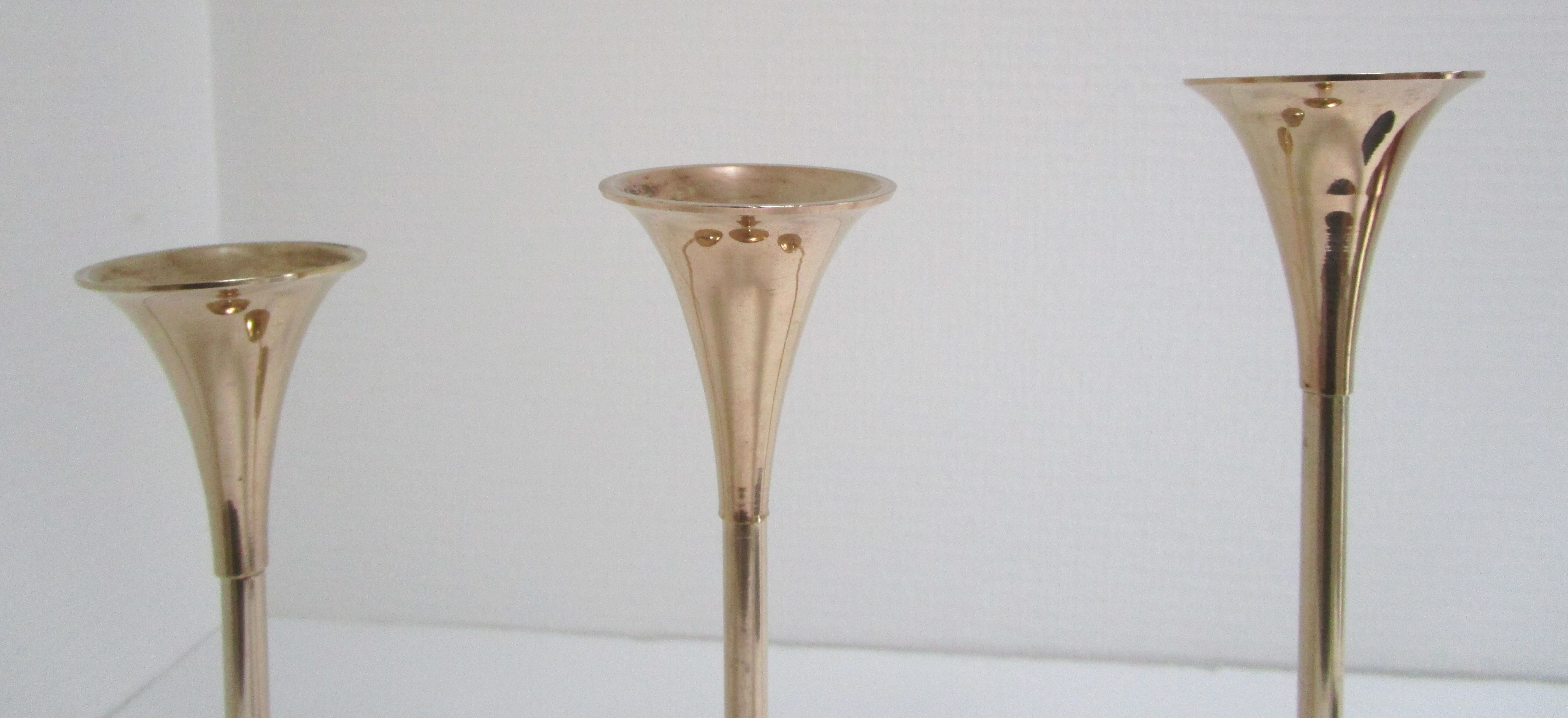 Trio of brass scandinavian candlesticks