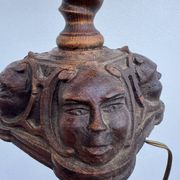 Sculpted wooden lamp with faces, antique.