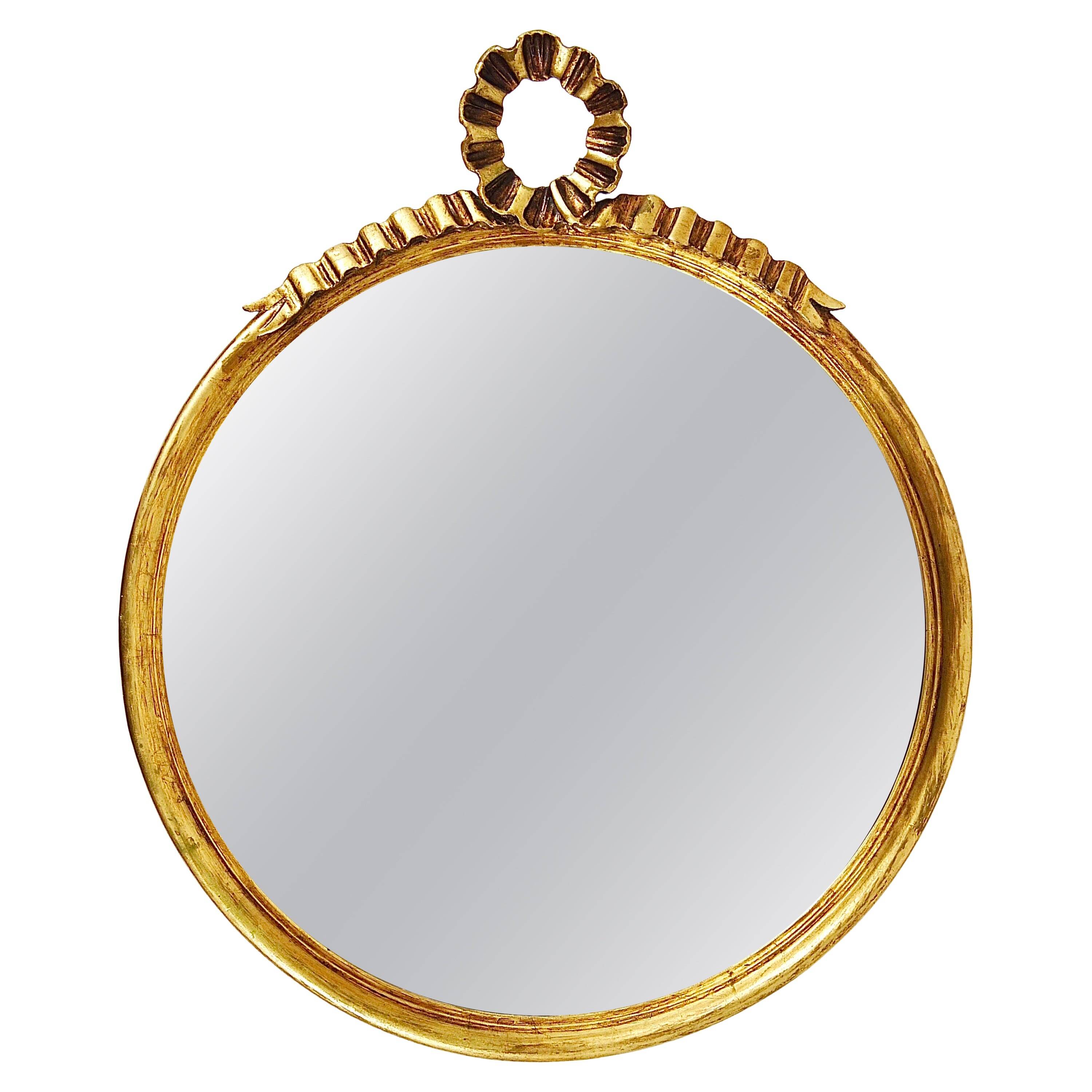 Round wall mirror in gilded wood, mid-century, C. Allodi & G. Subelli, Italy, 1950s.