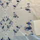 Hand-embroidered tablecloth