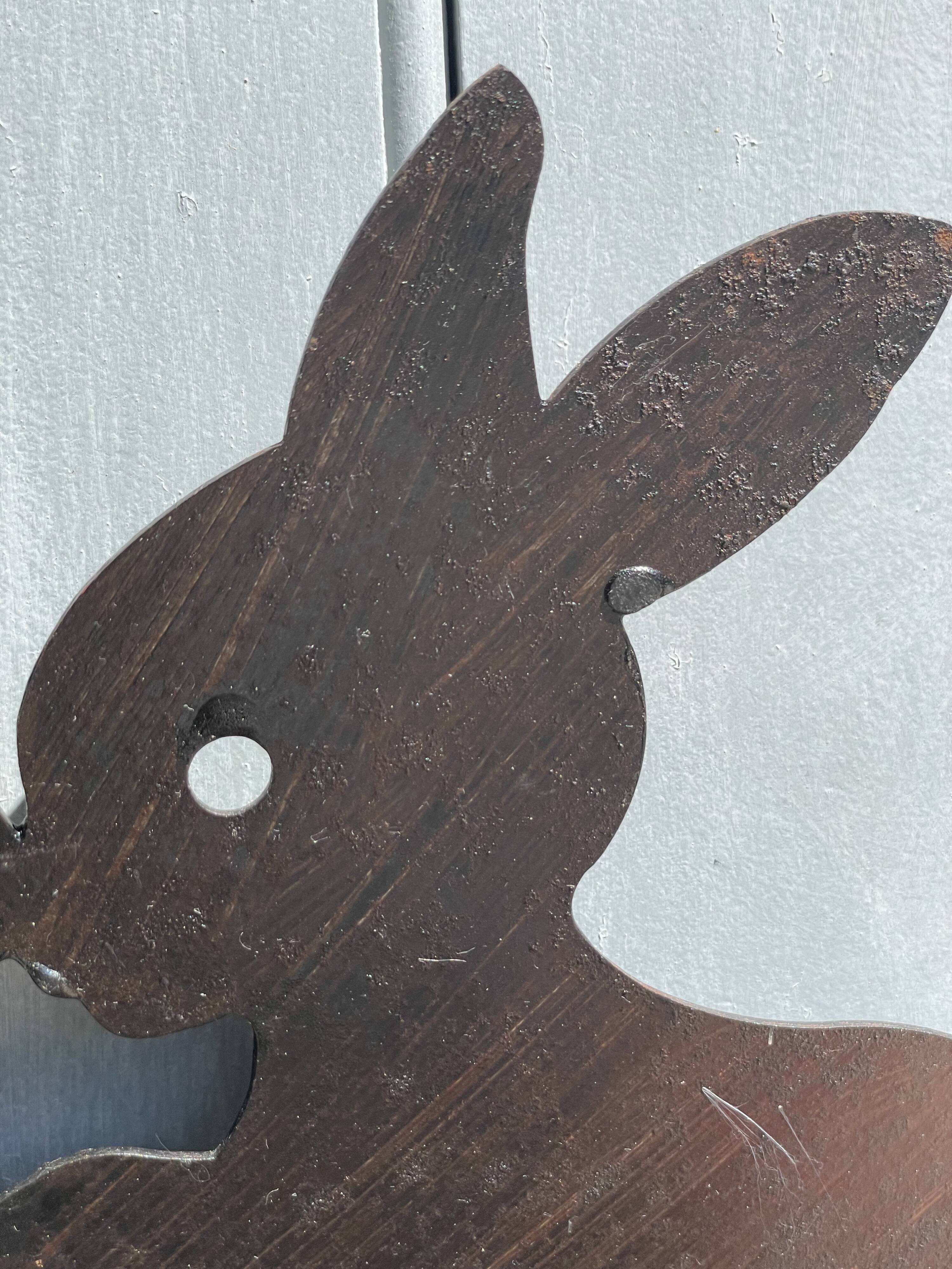 Cast iron plate in the shape of rabbits
