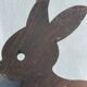 Cast iron plate in the shape of rabbits