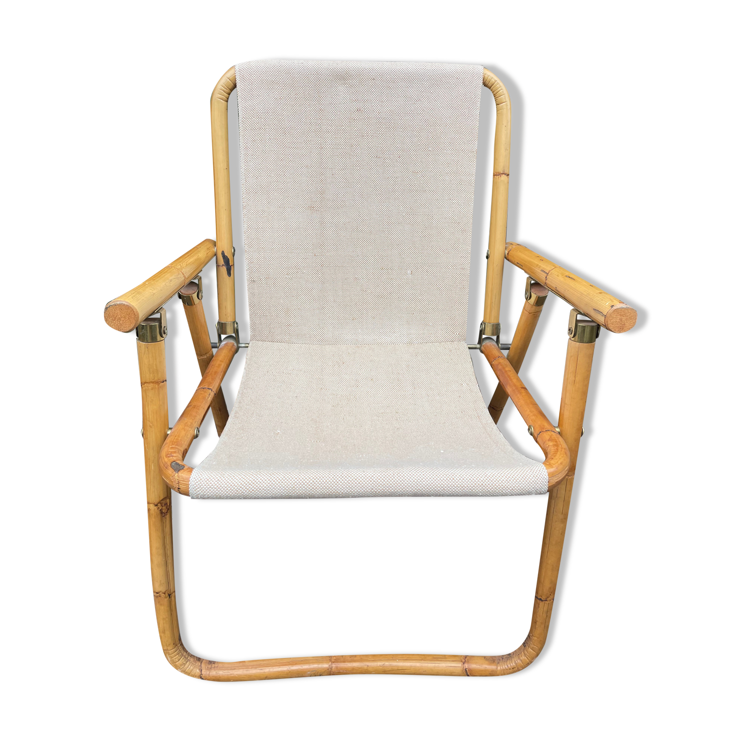 Rattan armchair and foldable canvas
