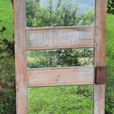 Mirror (3 panels) on door.