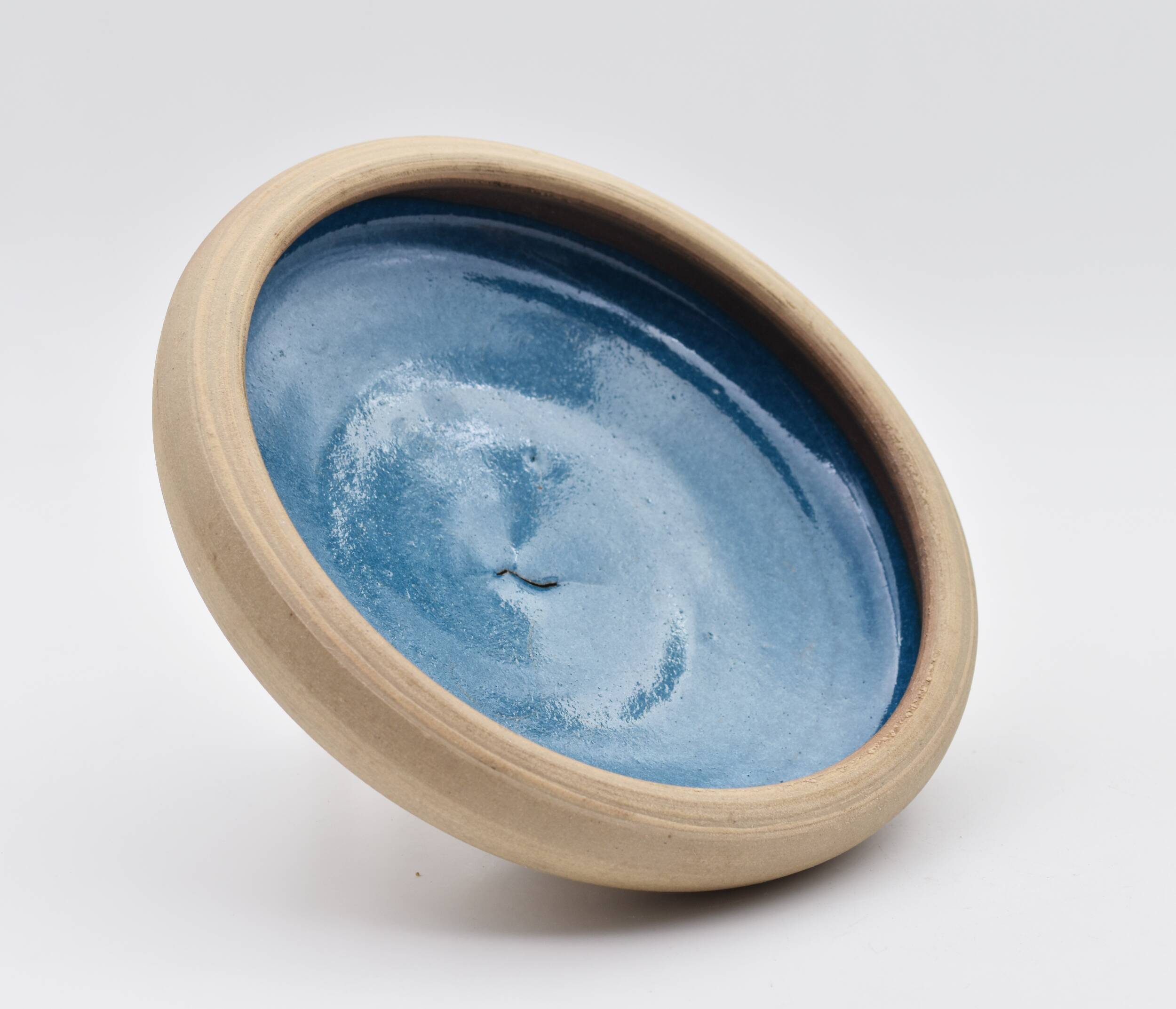 Blue enamelled sandstone cup