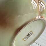 Ceramic pitcher in the shape of a slip pear.