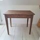 Old farmhouse side table in country style