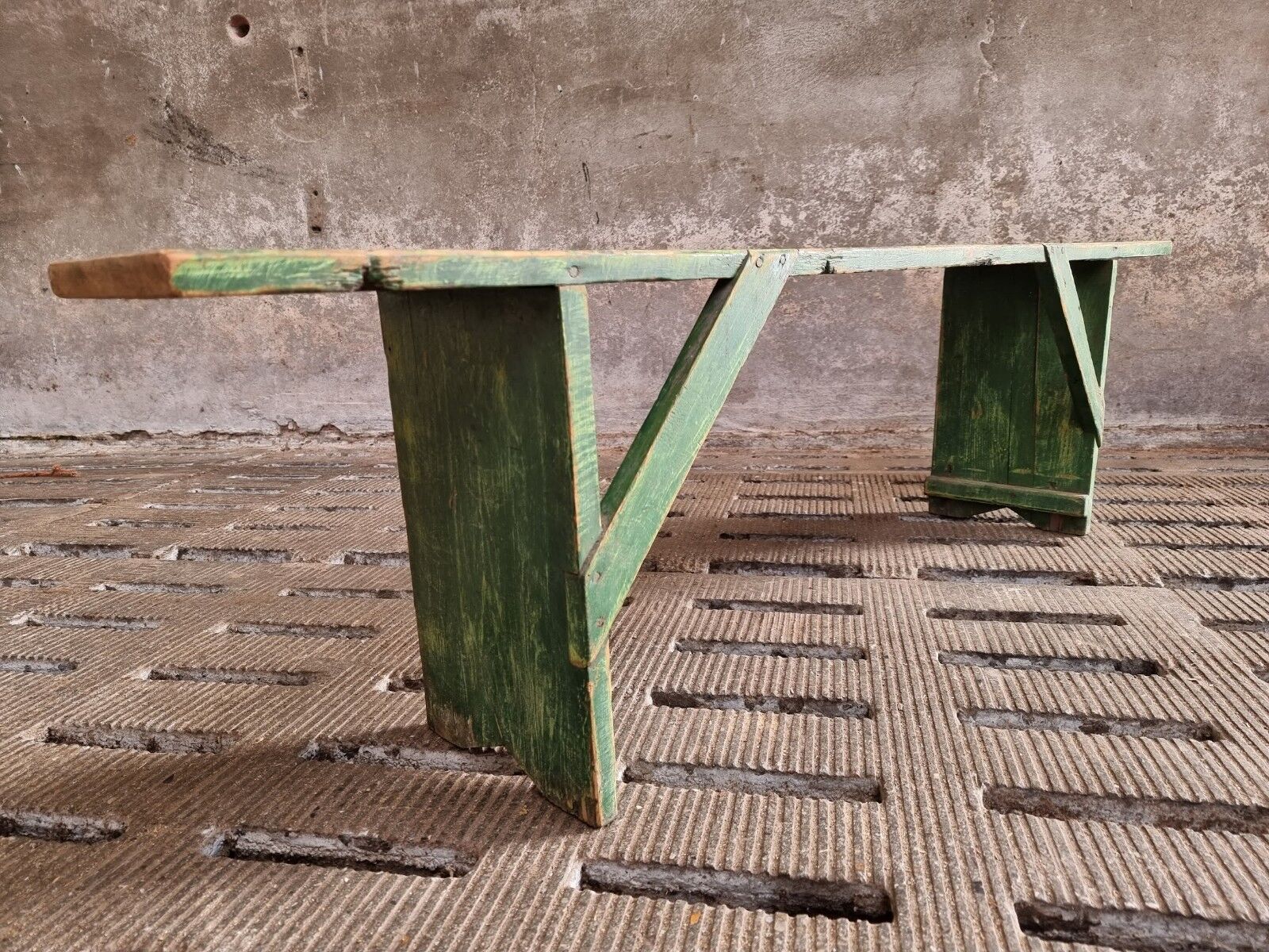 Old wooden bench side table grass green