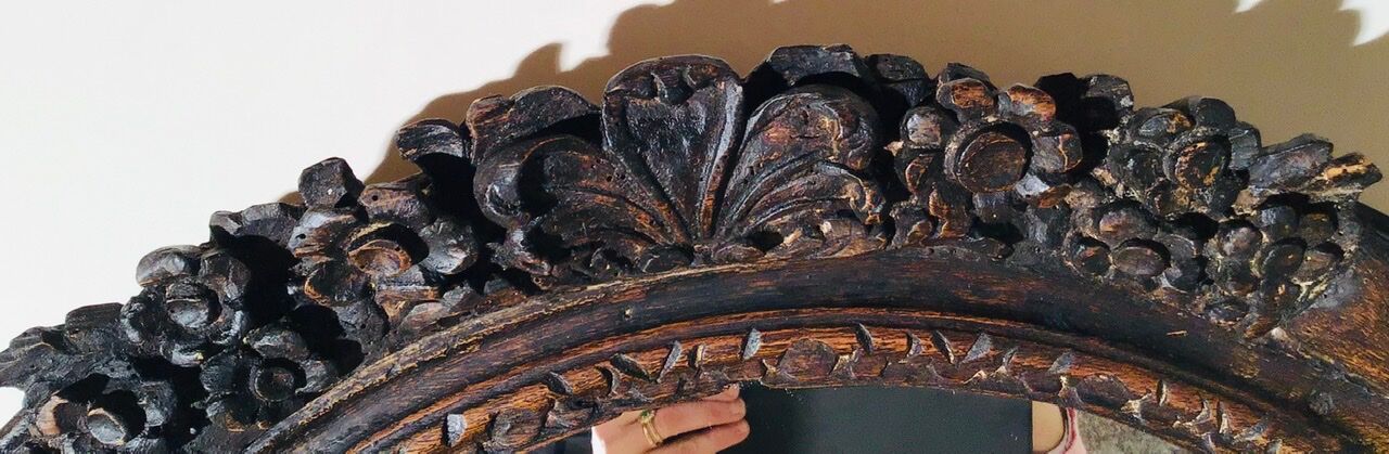 Oval mirror on an 18th century frame