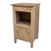 Antique wooden bedside table with a pink/orange marble top.