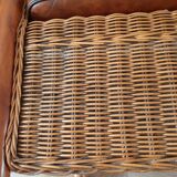 Armchair in woven rattan and exotic wood