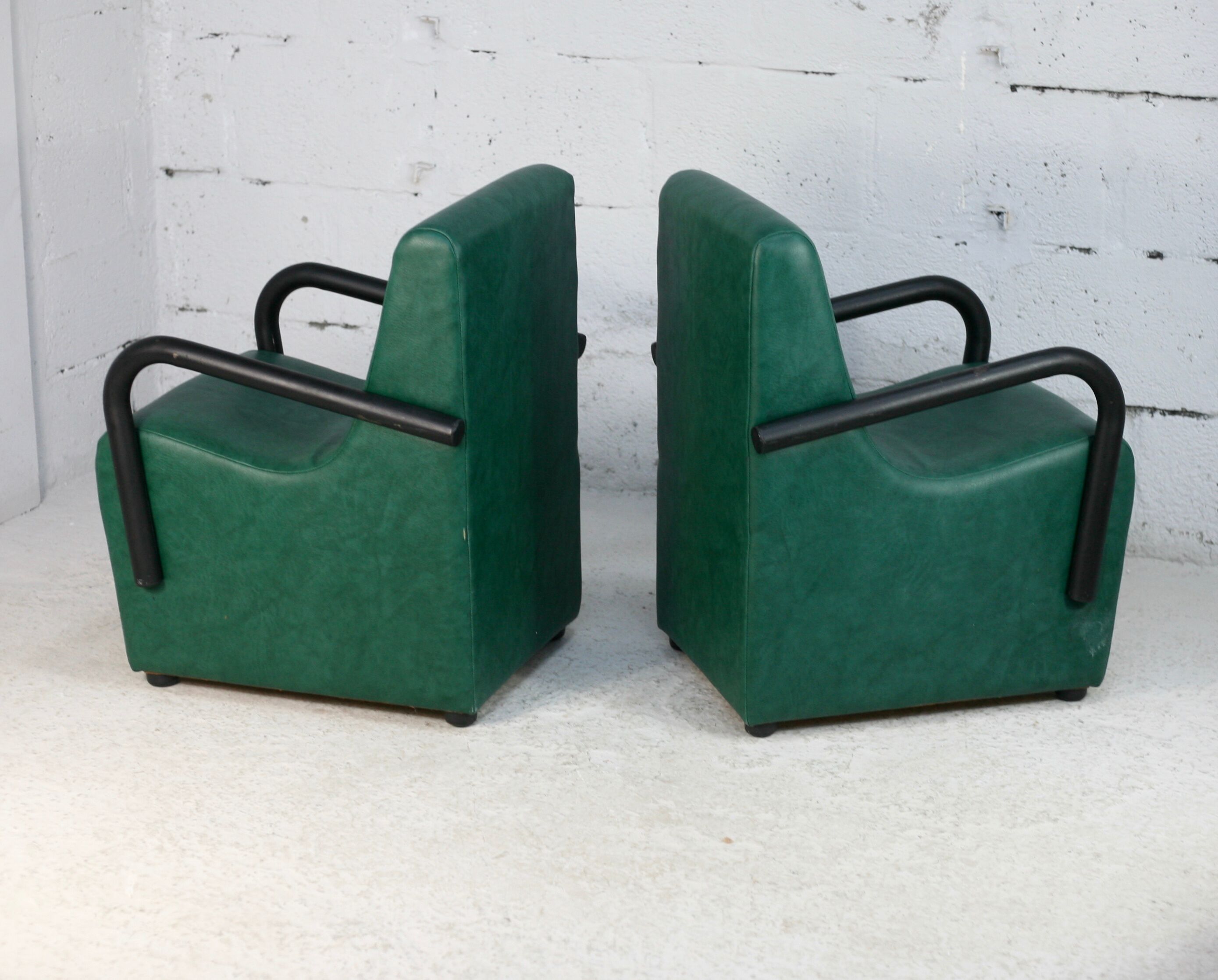 Pair of armrest heaters. Steel and green imitation leather. France, circa 1980