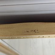 Miroir en bois doré, de forme organique avec une glace biseauté