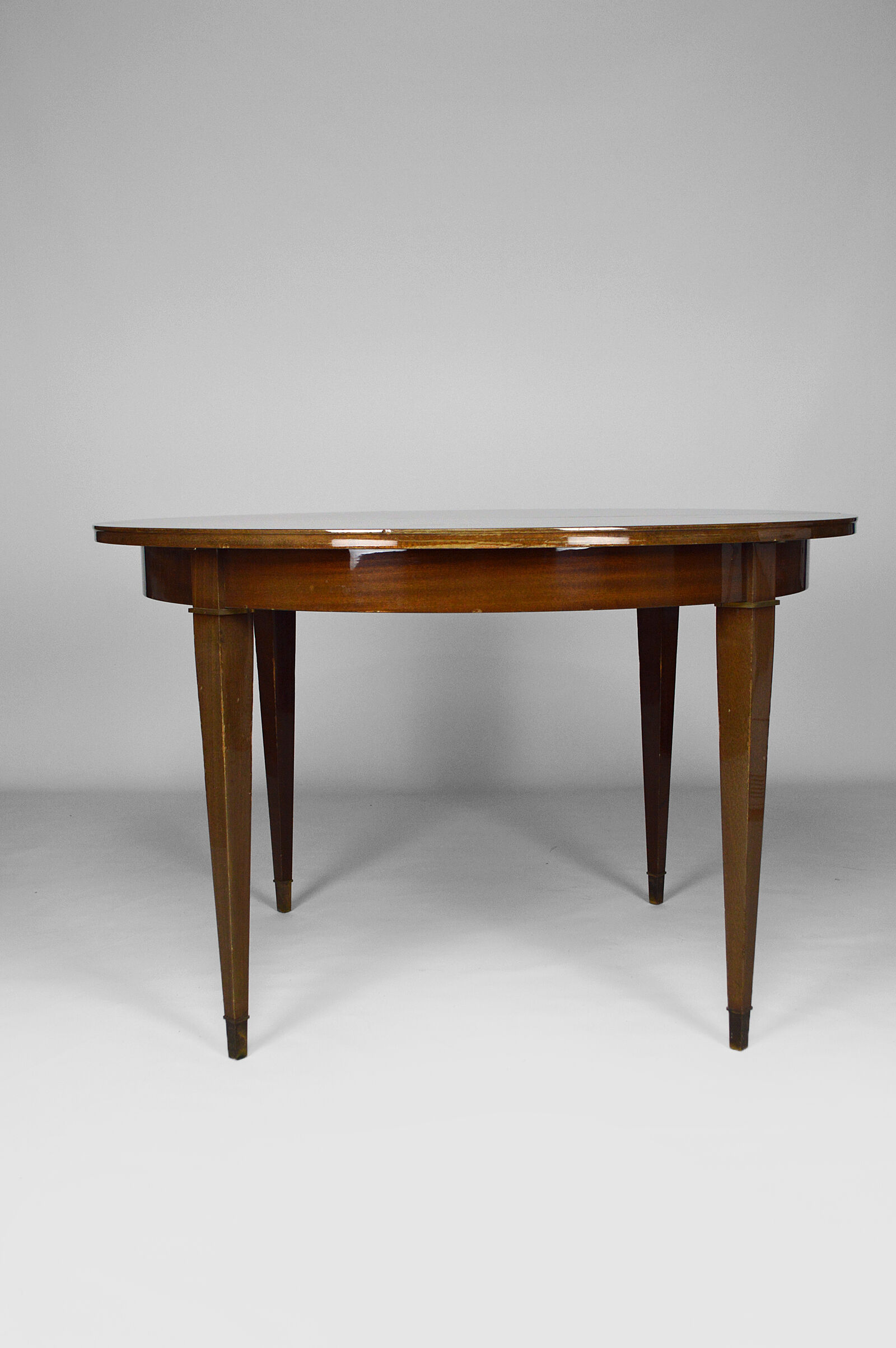 Art Deco mahogany round table by Jacques Adnet around 1940