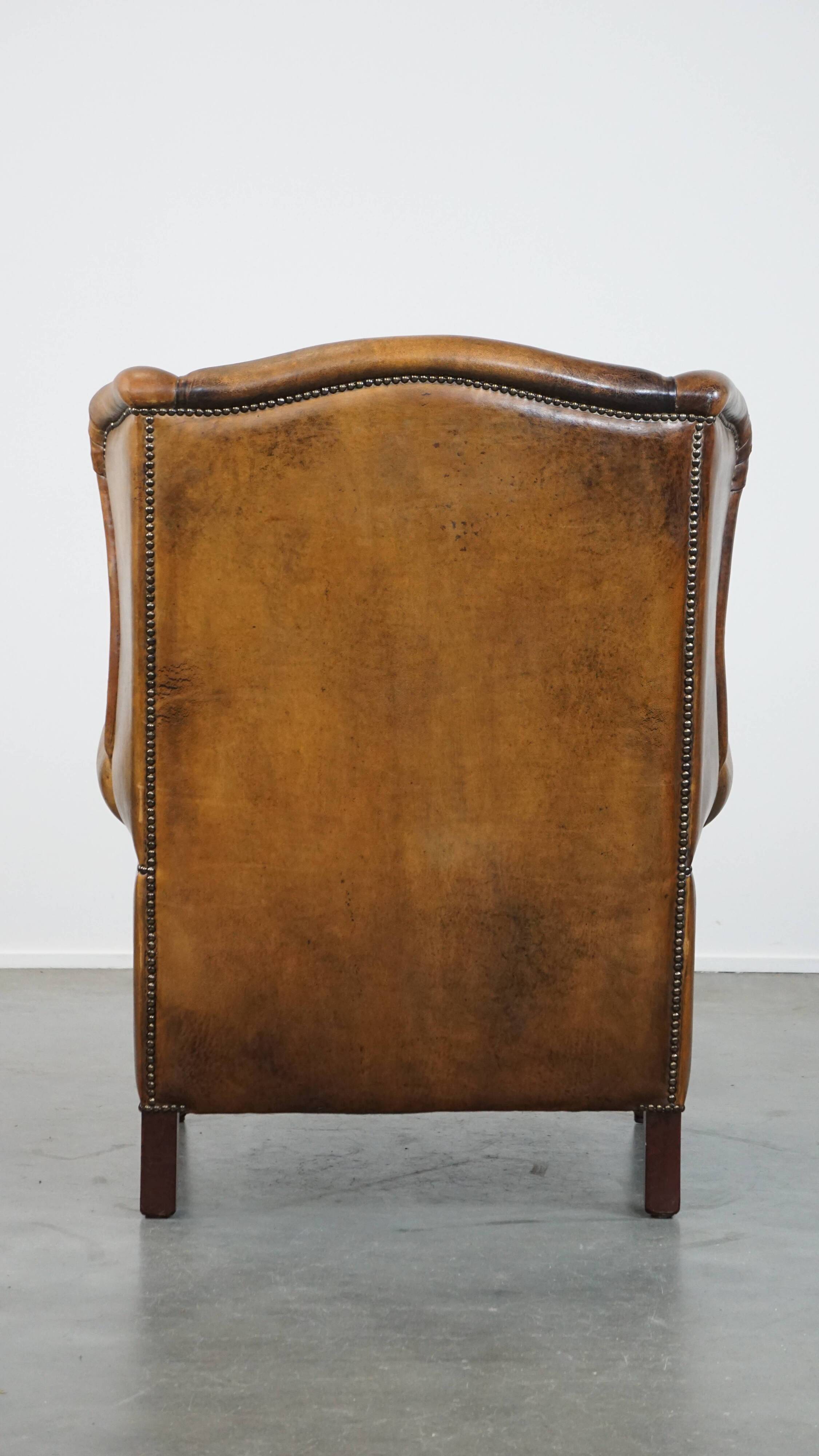 Sheepskin wing chair + XXL patinated footrest