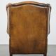 Sheepskin wing chair + XXL patinated footrest