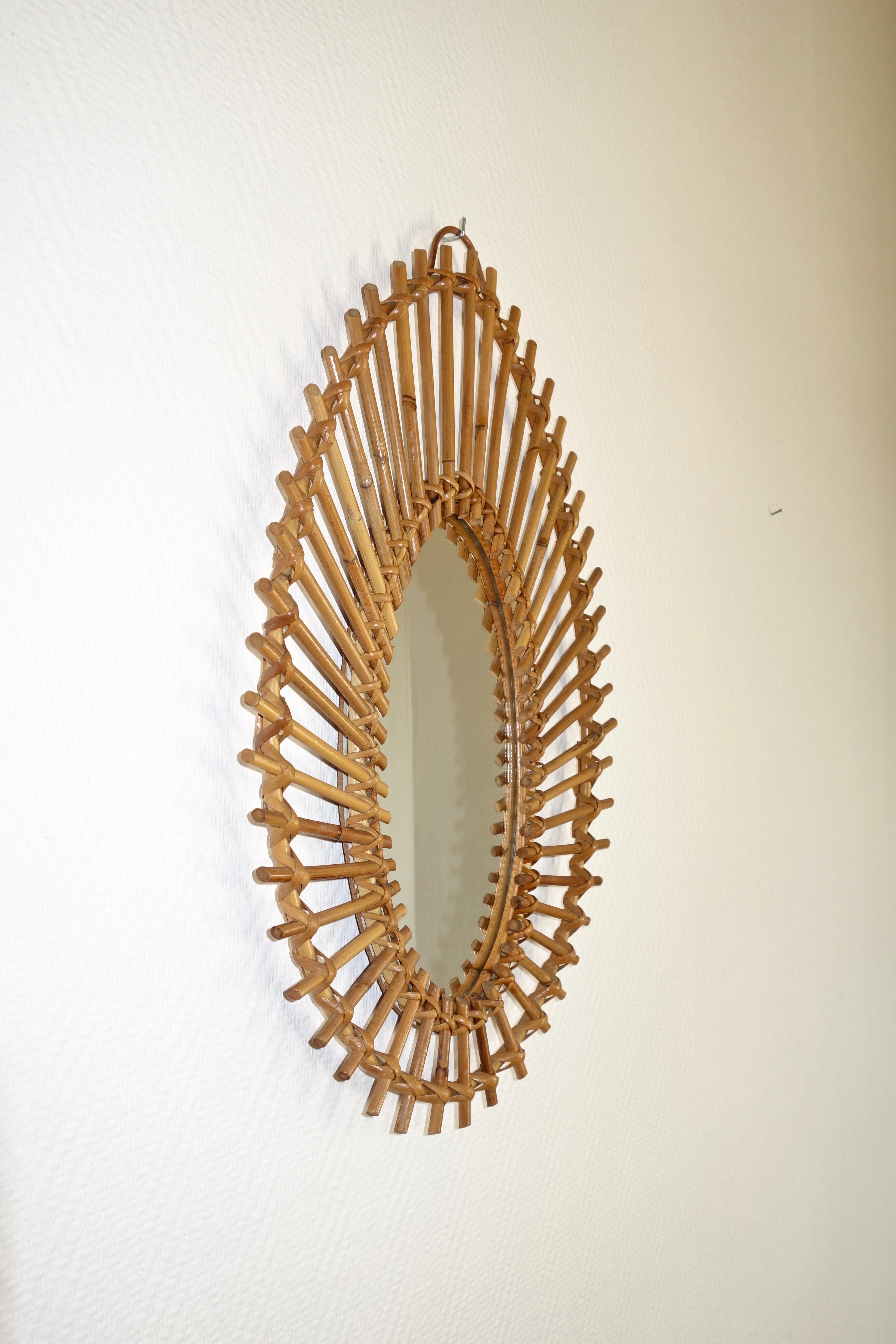 Free-form sun mirror in 60s rattan