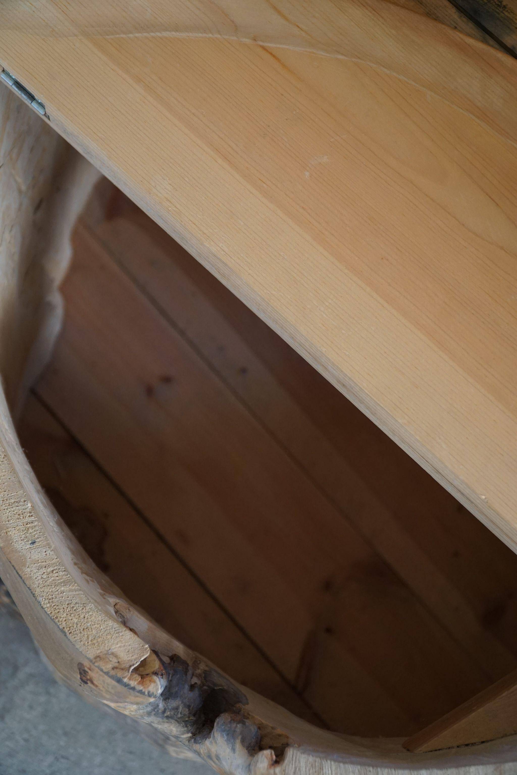 Sculptural Norwegian trunk chair in mid-century brutalist solid wood.