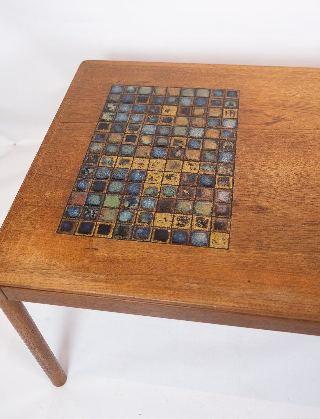 Coffee table in teak with brown ceramic tiles of danish design from the 1960s.