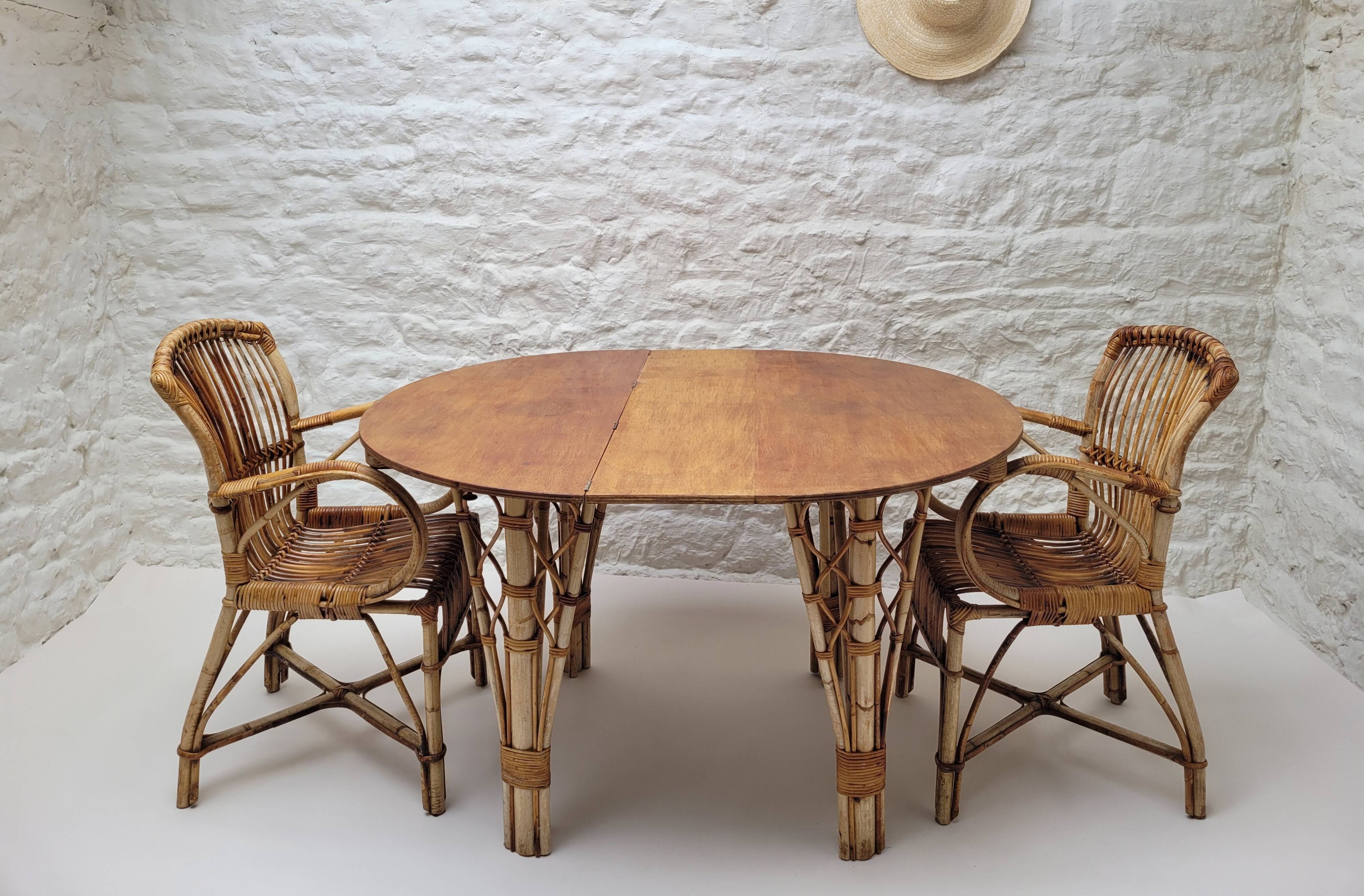 Vintage Audoux Minet bamboo, rattan, and smoked glass table duo.