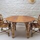 Vintage Audoux Minet bamboo, rattan, and smoked glass table duo.