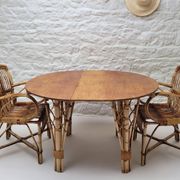 Vintage Audoux Minet bamboo, rattan, and smoked glass table duo.