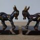 Bookends in the style of stylised donkeys, patinated metal and marble - circa 1940-1950.