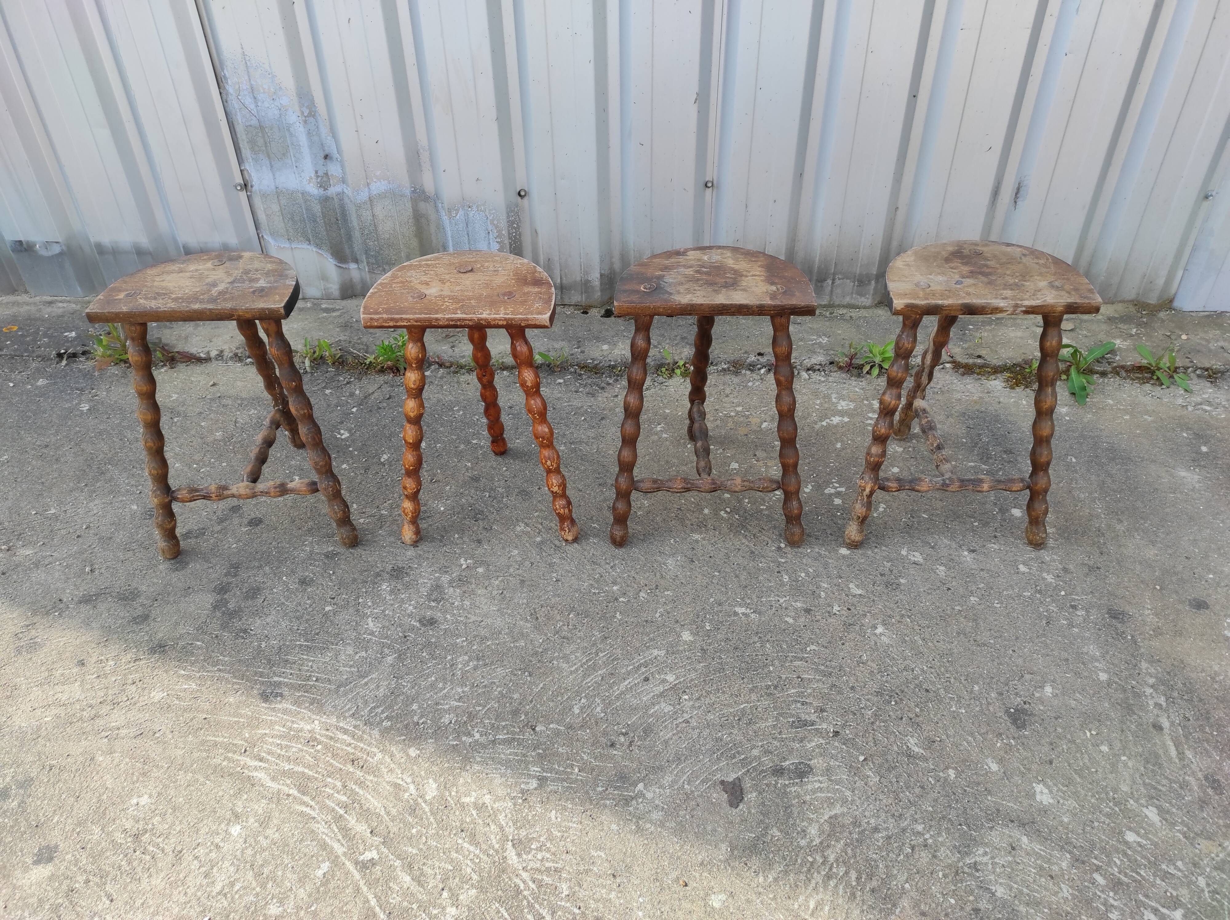 Lot 4 twisted wood tripod stools