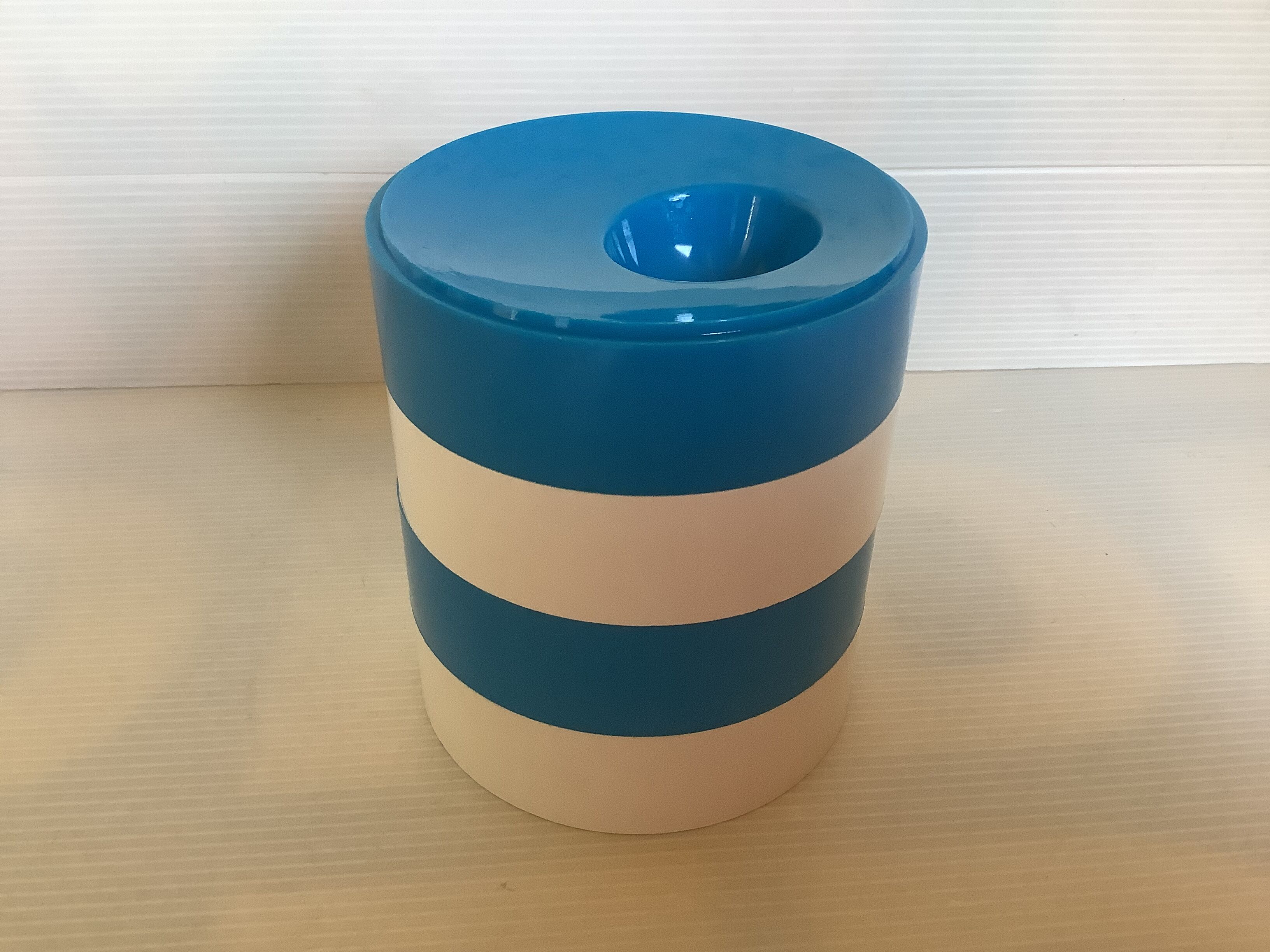 Four round blue and white egg cups from the 1970s.