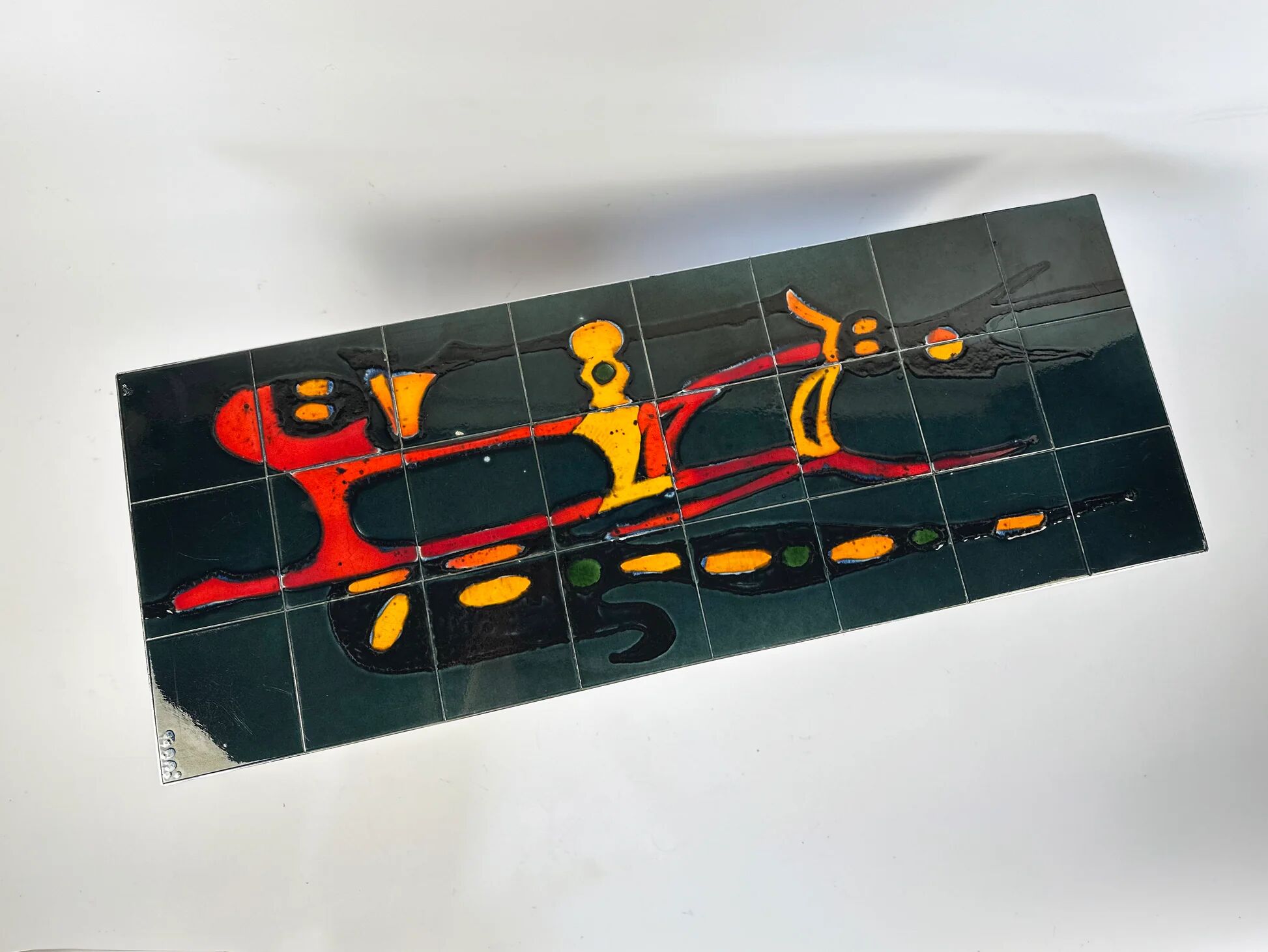 Mid-century coffee table with ceramic top by Adri Belgium.